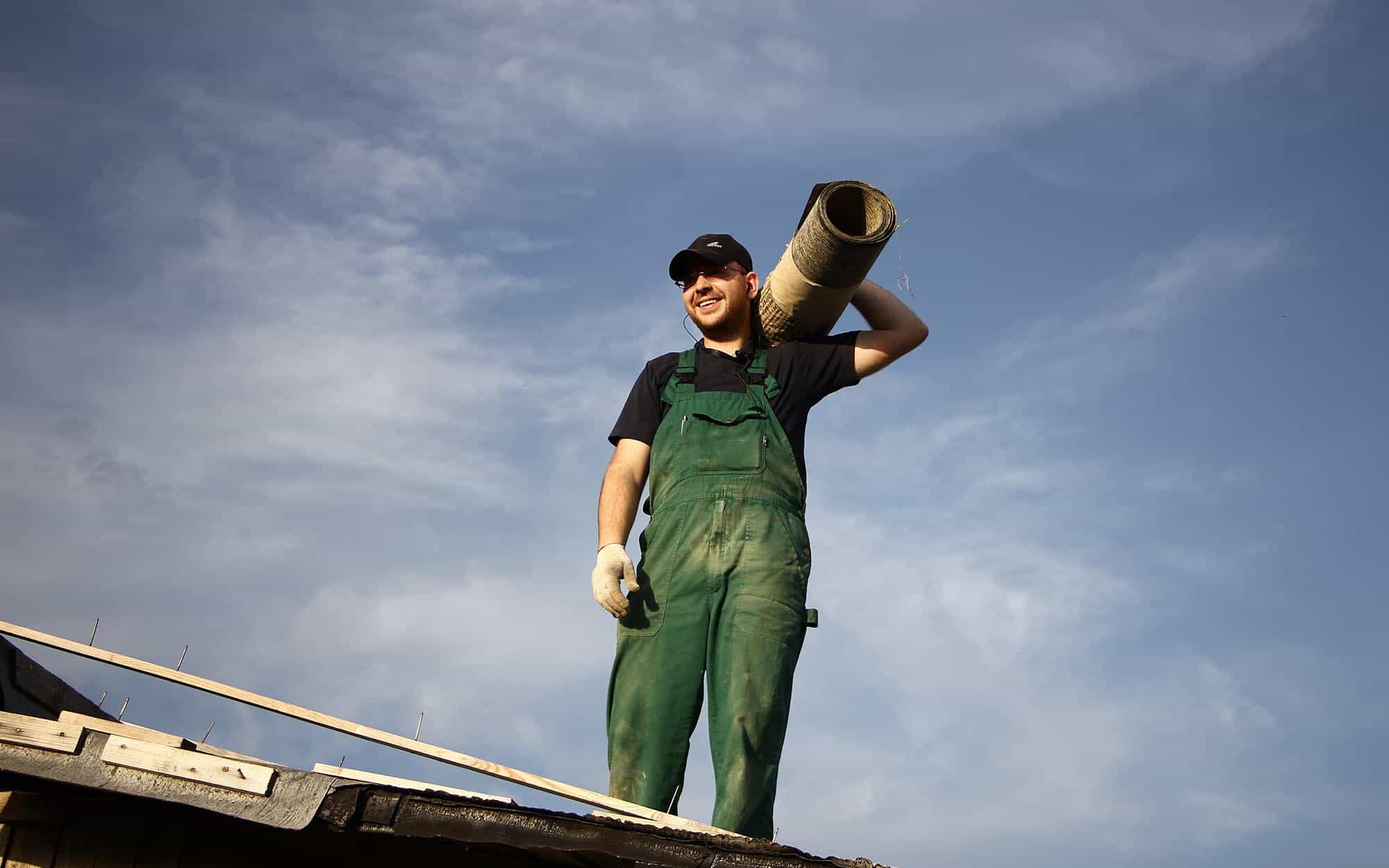 Front view of a happy roofer